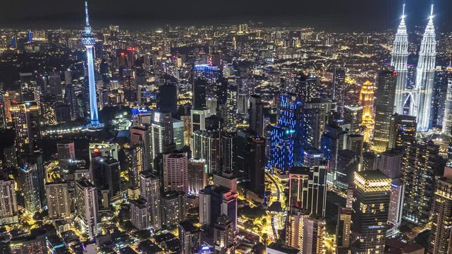 Bustling downtown asian city at night, aerial hyperlapse, Kuala Lumpur, Malaysia, 4K