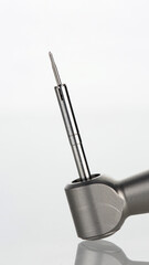 composition of dental tip and pin for surgery on a white background