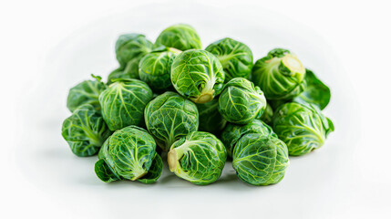 Fototapeta premium Fresh green Brussels sprouts on a white background, showcasing their vibrant color and healthy texture, perfect for nutritious me