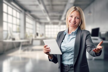 Happy mature woman hold digital tablet