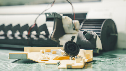An air conditioner that was disassembled on the floor from the air conditioner technician while cleaning the air conditioner.