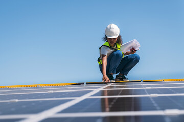 The engineer installs the solar panel, promoting the clean energy concept.