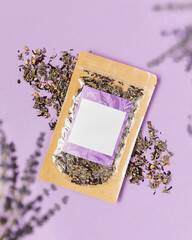 Lavender herbal tea bag on purple background 
