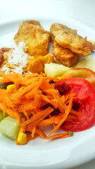 Vegetables on healthy traditional Brazilian meal named prato feito.	
