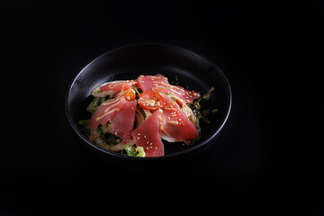Japanese salad isolated in black background