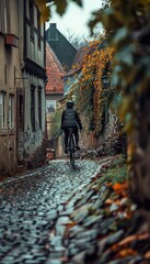 Cyclist Navigating Historic European Cobblestone Street with Charming Old Buildings at Sunset