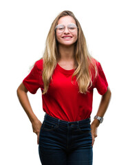 Young beautiful blonde woman wearing glasses over isolated background with a happy and cool smile on face. Lucky person.