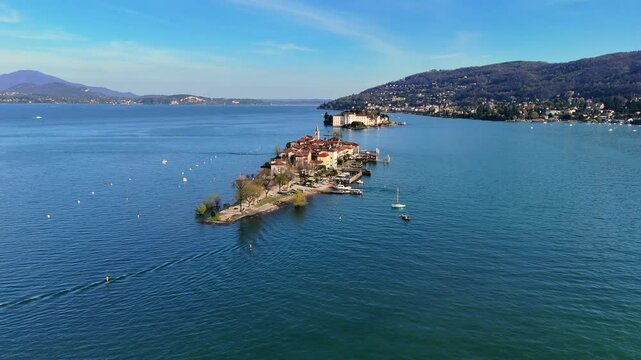 Isola Pescatore in the middle of Maggiore Lake with mountains in the background in Northern Italy