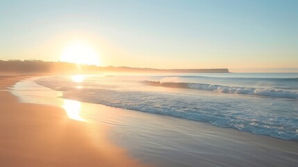 Fototapeta premium Wide view of a serene beach at sunrise. 