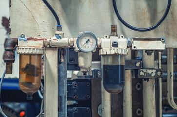 Manometer on industrial equipment. Large industrial equipment at the plant, pressure in the pipes