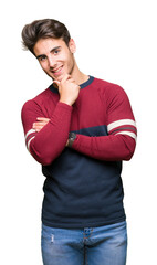 Young handsome man over isolated background looking confident at the camera with smile with crossed arms and hand raised on chin. Thinking positive.