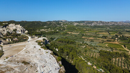 Aerial shot of the village of Baux-de-Provence in France. Tourist French town located on a rocky spur with its castle. One of the most beautiful villages you can visit while traveling in Provence.