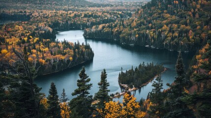 Serene autumn landscape featuring a winding river surrounded by colorful foliage in a tranquil mountain setting
