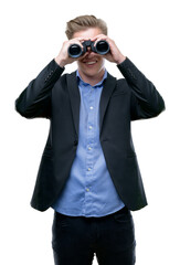 Young handsome blond man looking through binoculars with a happy face standing and smiling with a confident smile showing teeth