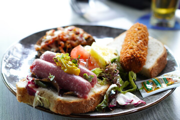 Dutch specialty croquettes (Kroket)and sausage on toast