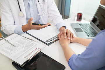 A doctor who is medical advisor is comforting the young woman after discovering a medical condition that will take time to be treated and giving advice on her health care. medical consultant concept