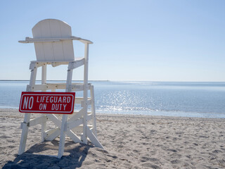 Empty lifeguard chair at Short Beach in Stratford Connecticut during the day. 
