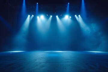 Stage illuminated by blue spotlights
