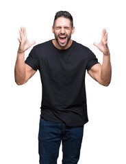 Young handsome man over isolated background celebrating mad and crazy for success with arms raised and closed eyes screaming excited. Winner concept