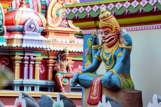 Indian God Nrsimhadeva sits in lotus position on a temple in Trivandrum, India.