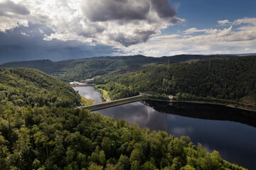 Barrier lake of the Oder river in front of the dam - near the town of Bad Lauterberg, Harz mountains, Lower Saxony, Germany. Aerial view.
