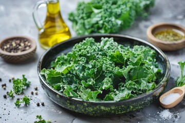 Curly kale leaves on plate with seasonings and olive oil perfect for kale chips or salad Promotes healthy eating and lifestyle Focus on ingredients