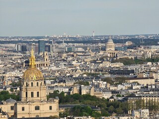 Obraz premium Paris, France - April 12, 2024: Aerial view of Paris skyline with dense urban sprawl and modern skyscrapers, Ile de France, France. Amazing mix between modern skyscraoers and old buildings.