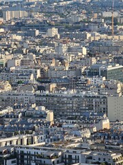 Obraz premium Paris, France - April 12, 2024: Aerial view of Paris skyline with dense urban sprawl and modern skyscrapers, Ile de France, France. Amazing mix between modern skyscraoers and old buildings.