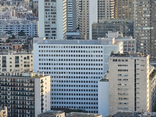 Paris, France - April 12, 2024: Aerial view of Paris skyline with dense urban sprawl and modern...