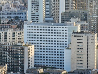 Paris, France - April 12, 2024: Aerial view of Paris skyline with dense urban sprawl and modern...