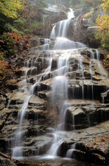 Fototapeta premium Cloudland Falls in Franconia Notch State Park. This is the tallest and most impressive waterfall along Falling Waters hiking trail in the White Mountains of New Hampshire.