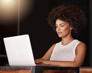 Business, woman and typing on laptop at night for company admin, feedback email or checking website. Professional, entrepreneur and owner with technology for work deadline, networking and planning