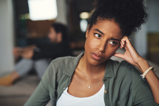 Black woman, angry and divorce fight in home with ignoring partner, frustrated and problem for toxic marriage. African lady, stress and conflict for infidelity, cheating man and confess for gambling