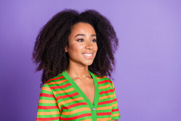 Photo of adorable lovely girl wear striped shirt looking empty space isolated violet color background