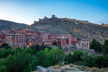 Panoramic view of Albarracín, Teruel, Aragon, Spain, illuminated at dusk, with the old town and...