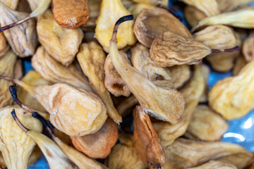 Cured or dried pear in the market close-up. Background. Selected focus