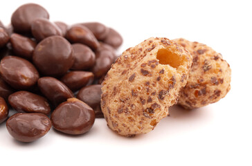 Crunchy Freeze Dried Milk Chocolate Covered Caramel Disks Isolated on White Background