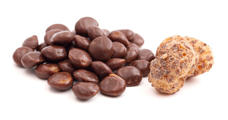 Crunchy Freeze Dried Milk Chocolate Covered Caramel Disks Isolated on White Background