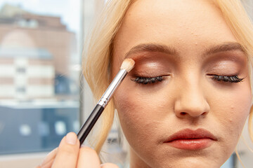 Makeup process for woman. Makeup on problem skin with acne