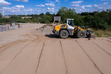 the soil is compacted and levelled with a road roller