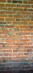 A brick wall with a heart drawn on it