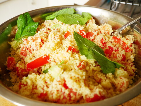 Taboulet dish with mint leaves, tomatoes
