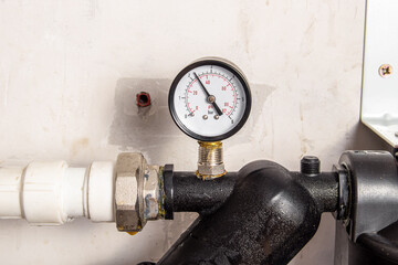 Coarse water filter. Water purification filter with pressure gauge. Pressure sensor closeup
