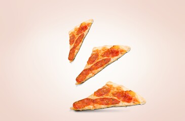 Tasty hot Pizza slices flying on background