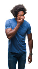 Afro american man over isolated background bored yawning tired covering mouth with hand. Restless and sleepiness.