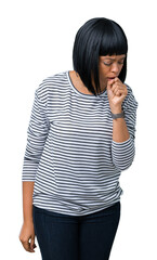 Beautiful young african american woman wearing stripes sweater over isolated background feeling unwell and coughing as symptom for cold or bronchitis. Healthcare concept.