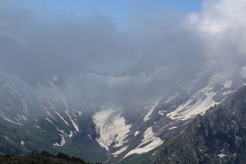 mountain peaks in the clouds Dombay midsummer