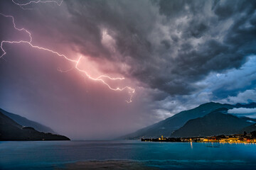 A strong thunderstorm with lots of lightning over Lake Como in Gravedona.