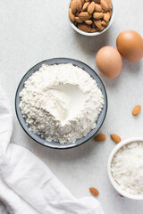 overhead view of mise en place for almond biscotti dough, ingredients for making almond cantucci...