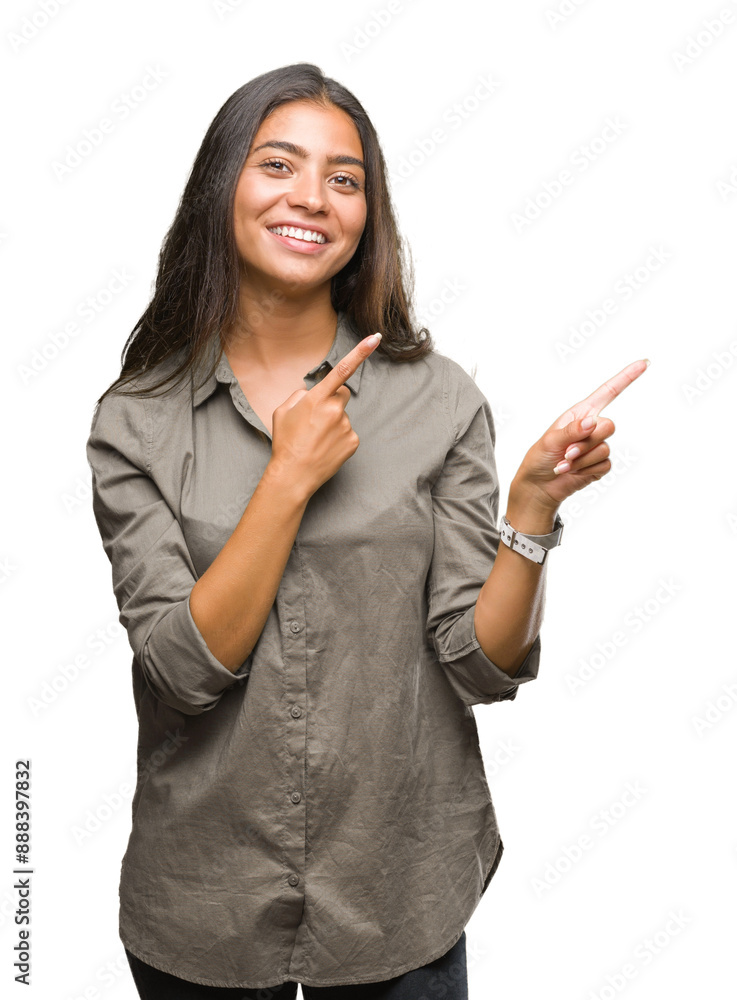 Sticker Young beautiful arab woman over isolated background smiling and looking at the camera pointing with two hands and fingers to the side.